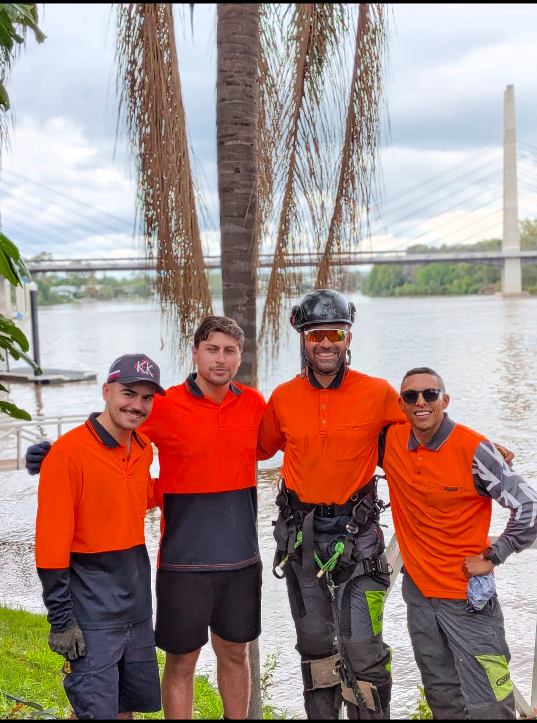 Gabe's Tree Service crew in orange hi-vis by the Brisbane River